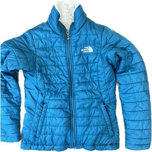 The North Face jacket is REVERSIBLE. It’s like getting 2 jackets in one.